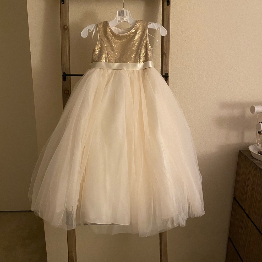 Flower girl dress size 4. Gold sequin with ivory tulle. Heart cut out on back.